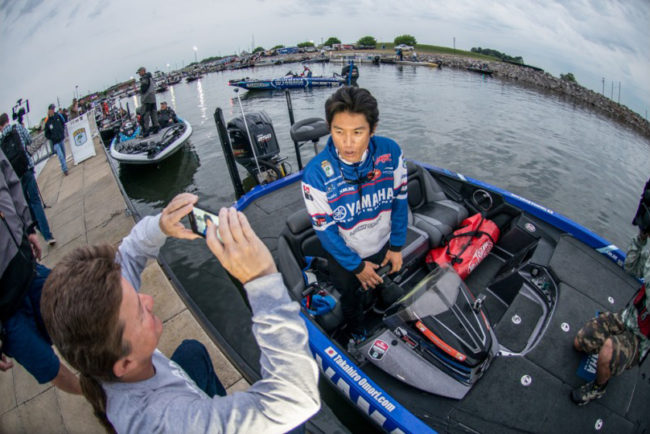 After a monster Day 2 bag Takahiro Omori does an interview for Facebook while in line to head out for Day 3. Photo: Garrick Dixon